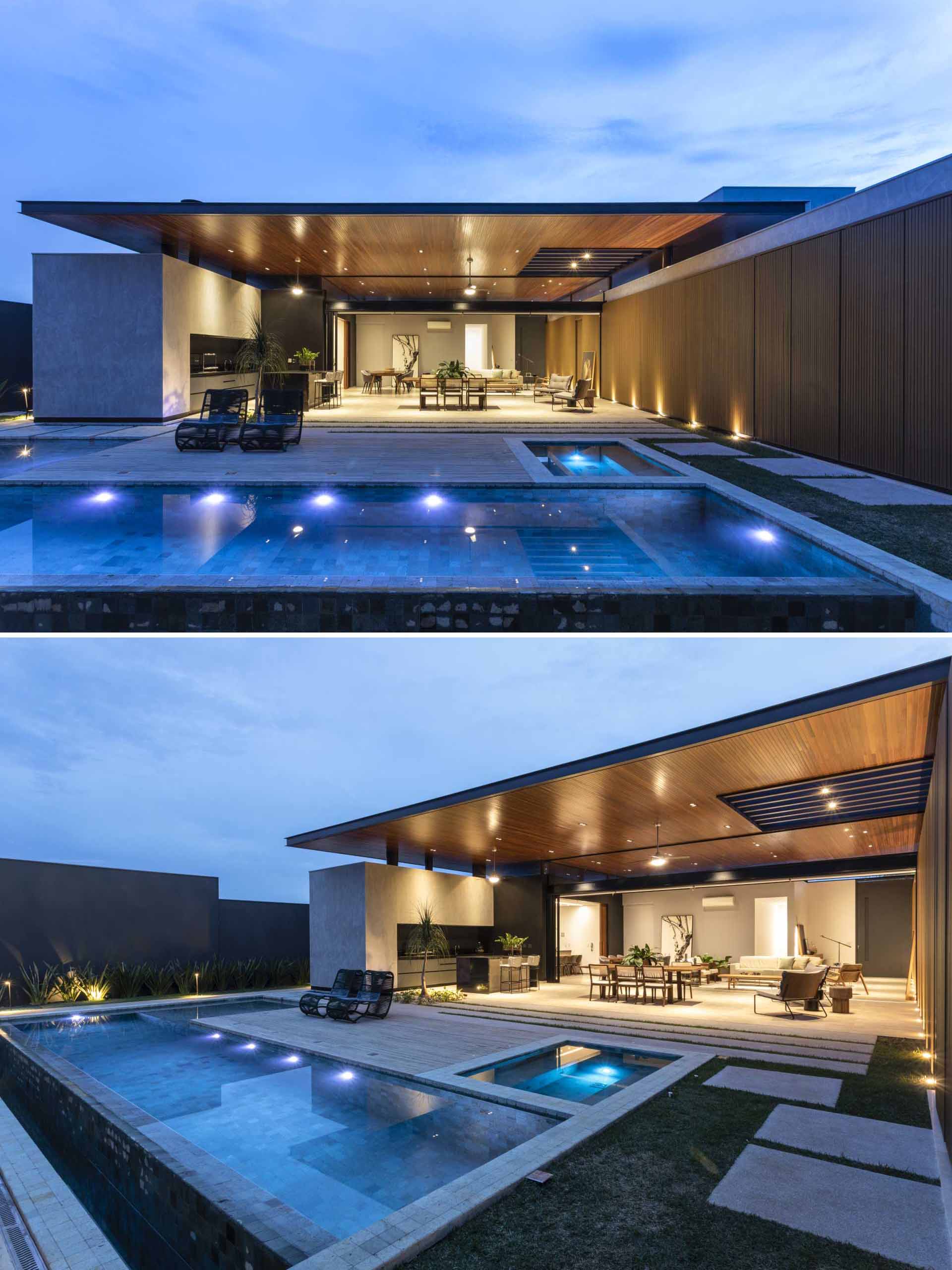 Un Espace Extérieur Conçu pour le Bien-être : Le design inclut une piscine en forme de L et un jardin paysagé, avec des dalles de pierre qui invitent à se promener au milieu de la verdure.
